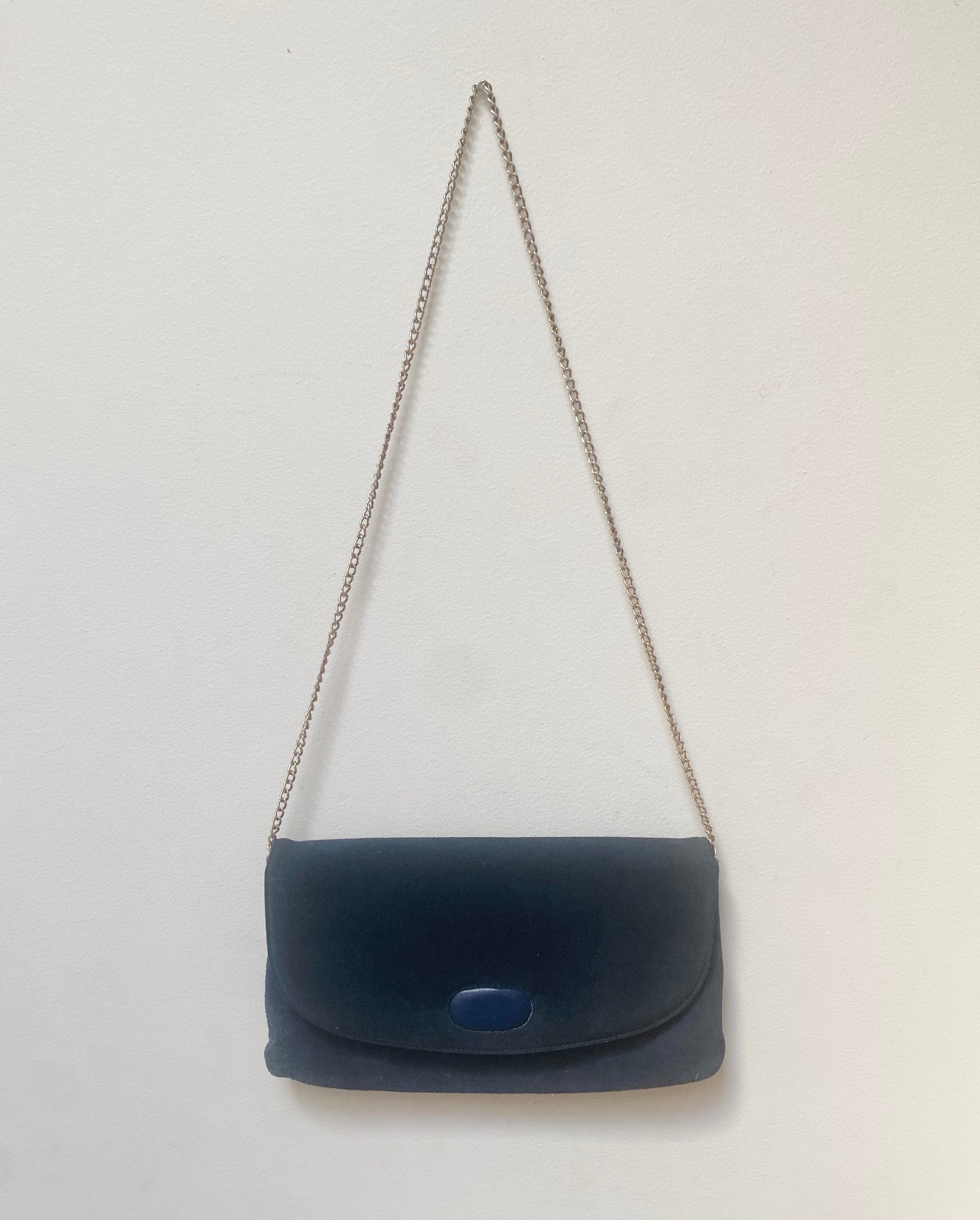 Vintage blue suede evening bag with long gilt strap.