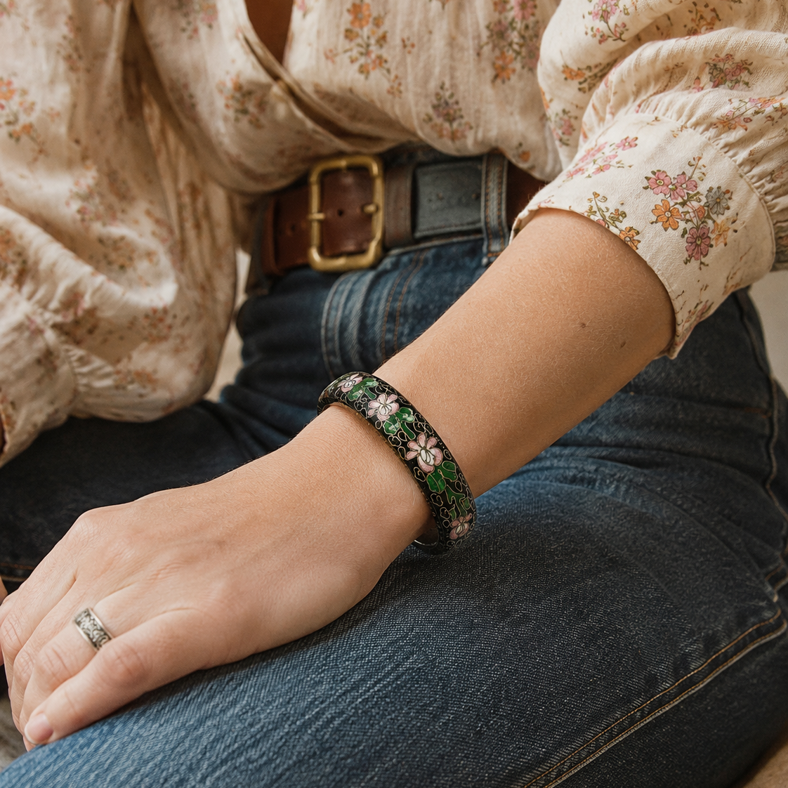 Model wearing 70s Cloisonne' floral bangle with a floral shirt and jeans.