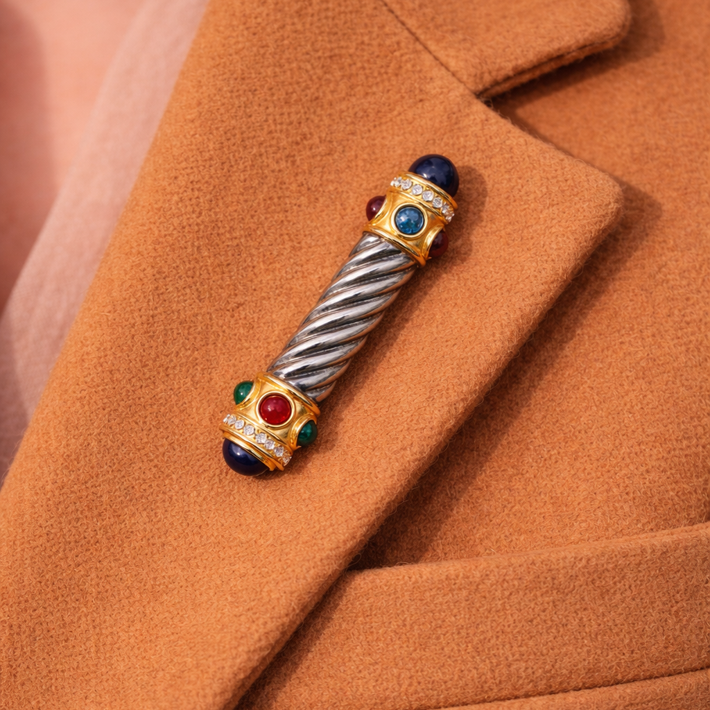 Vintage 1970s twisted rope bar brooch styled on a cashmere jacket. 