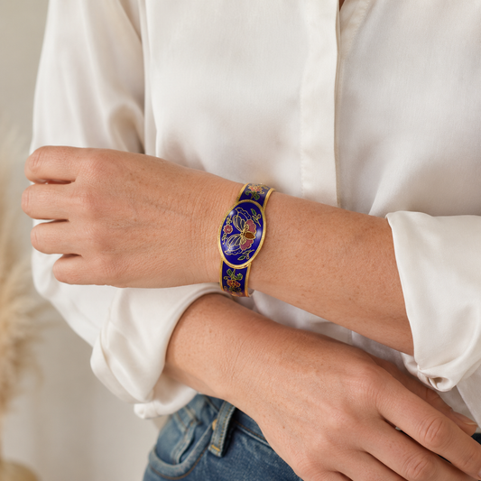 Vintage 1980s Cloisonne' bangle styled on a model wearing a white shirt and denim jeans. 