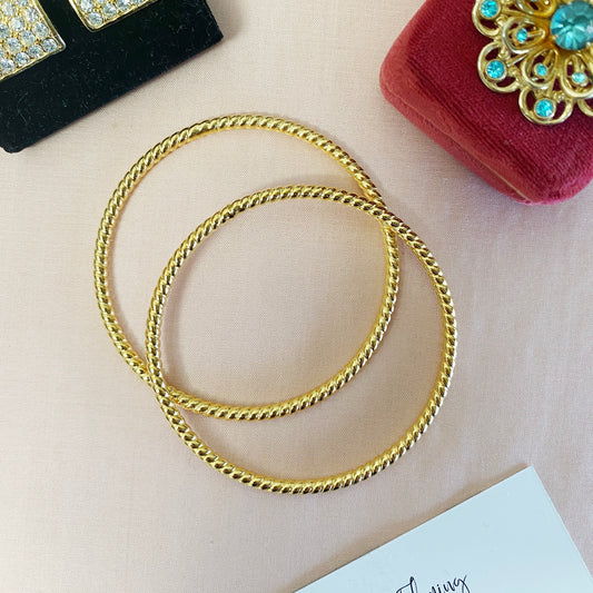 Vintage 1980s gold bangle set with 22kt gold plating, unworn deadstock from London"