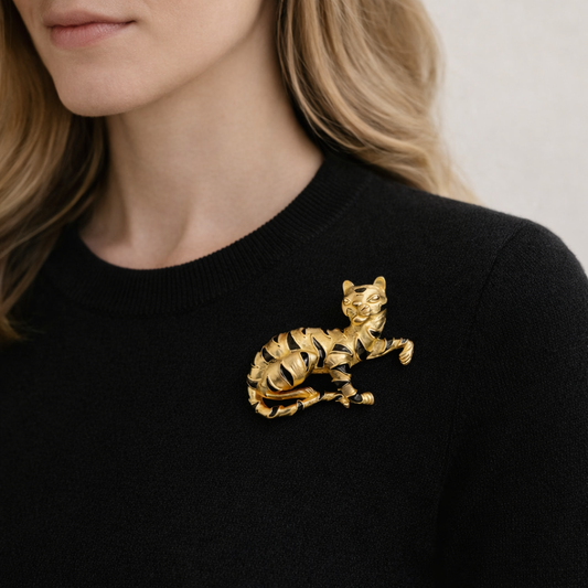 Style shot of 1980s Trifari Tiger Brooch on fine black knit. 