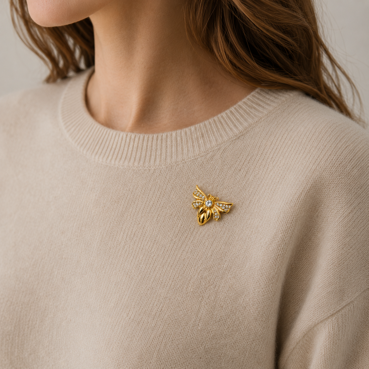 Model wearing 1990s Swarovski Crystal Brooch. 22kt gold plating. 