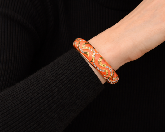 Vintage 1990s Joan Rivers, designer enamel bangle, styled with a black knit.