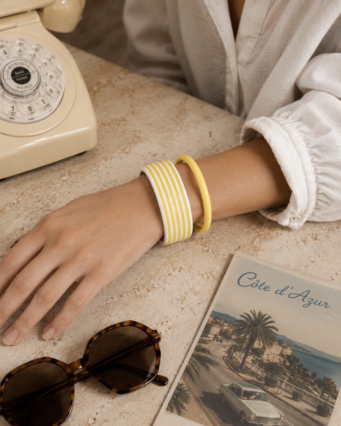 Vintage 80s, stripped Lucite bangle  and a opaque yellow spacer bangle - styled on a model.  