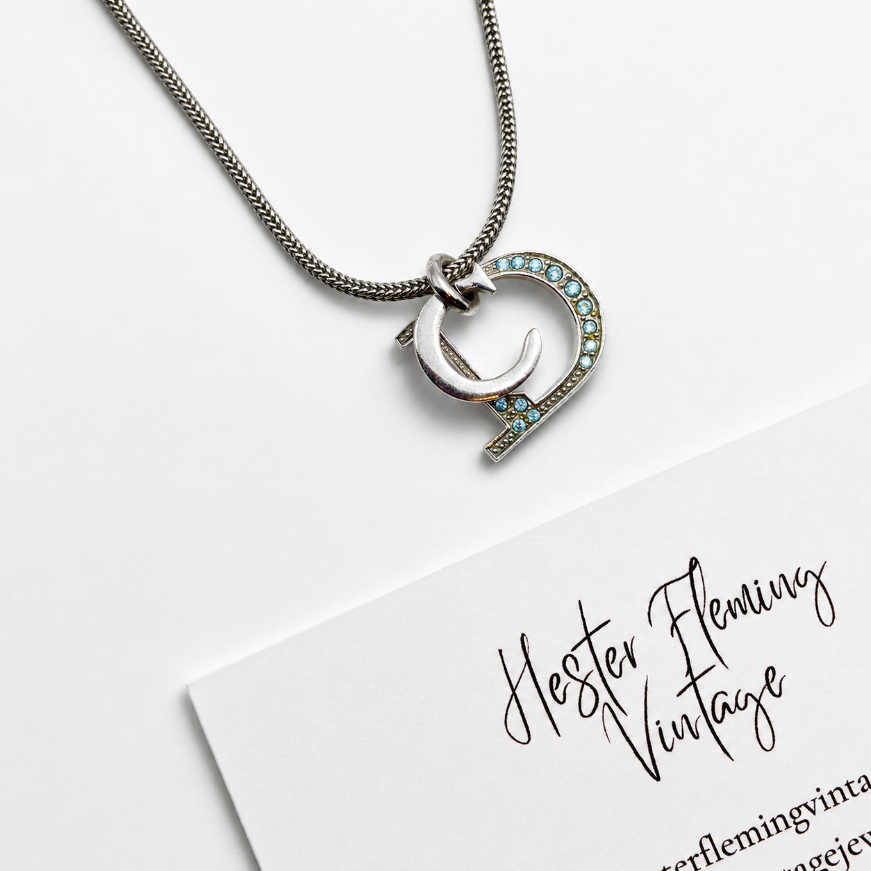 Vintage 90s Dior Necklace, close up of the logo pendant