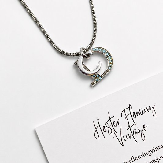 Vintage 90s Dior Necklace, close up of the logo pendant