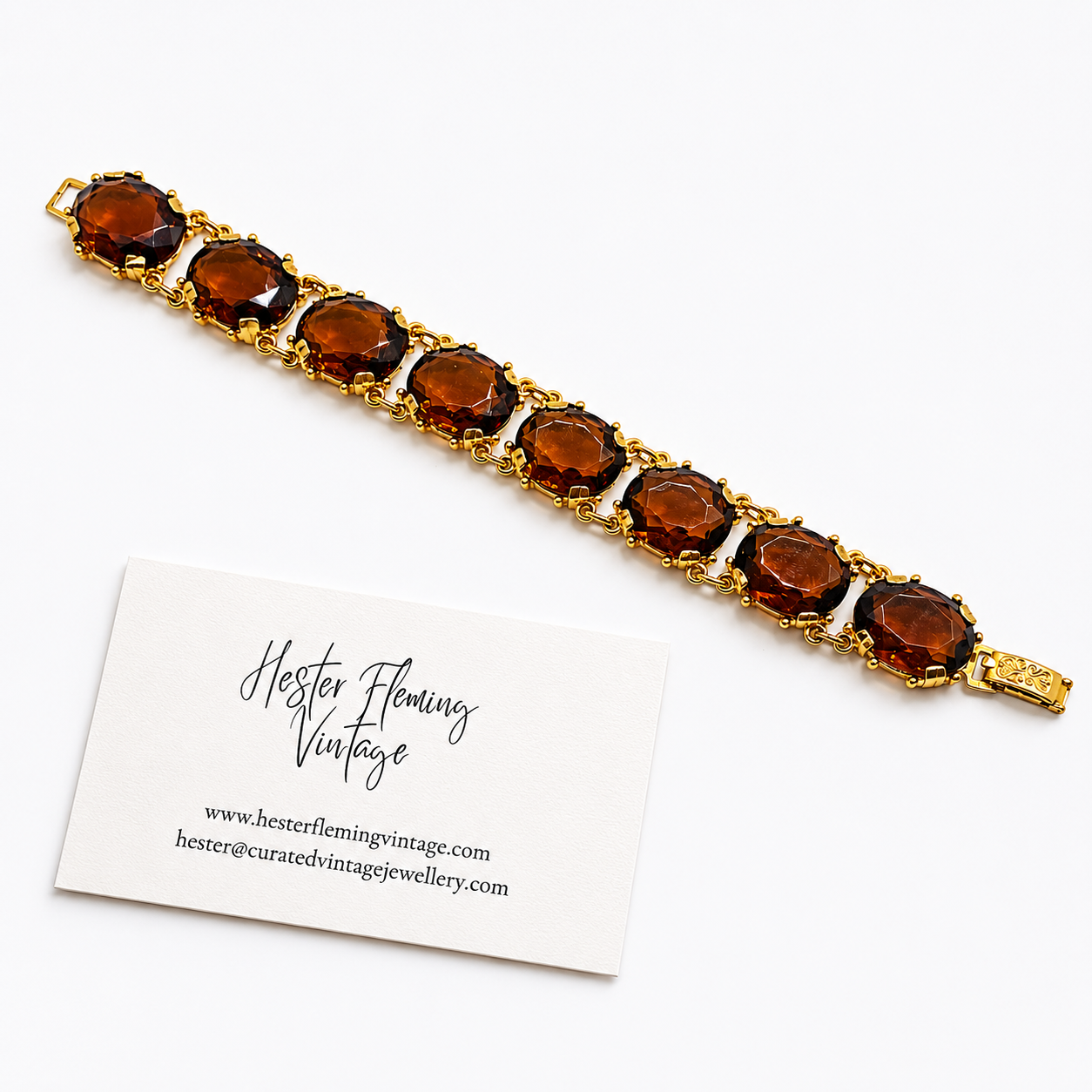 Flat lay of Vintage 90s Swarovski Crystal Amber Bracelet