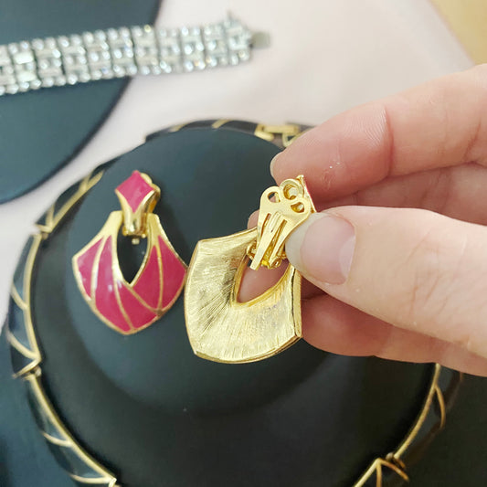 Close-up of vintage clip-on fastening on gold-plated enamel earrings from the 1980s