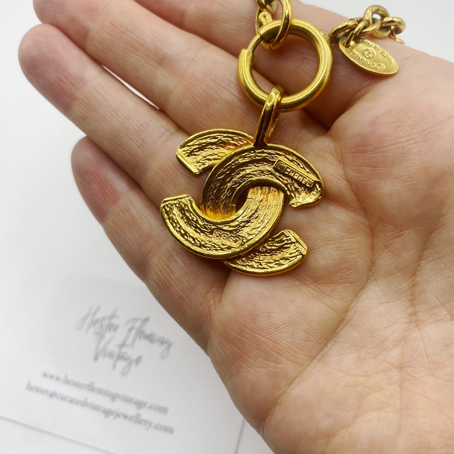 Back view of authentic 1980s Chanel logo pendant necklace in excellent vintage condition.