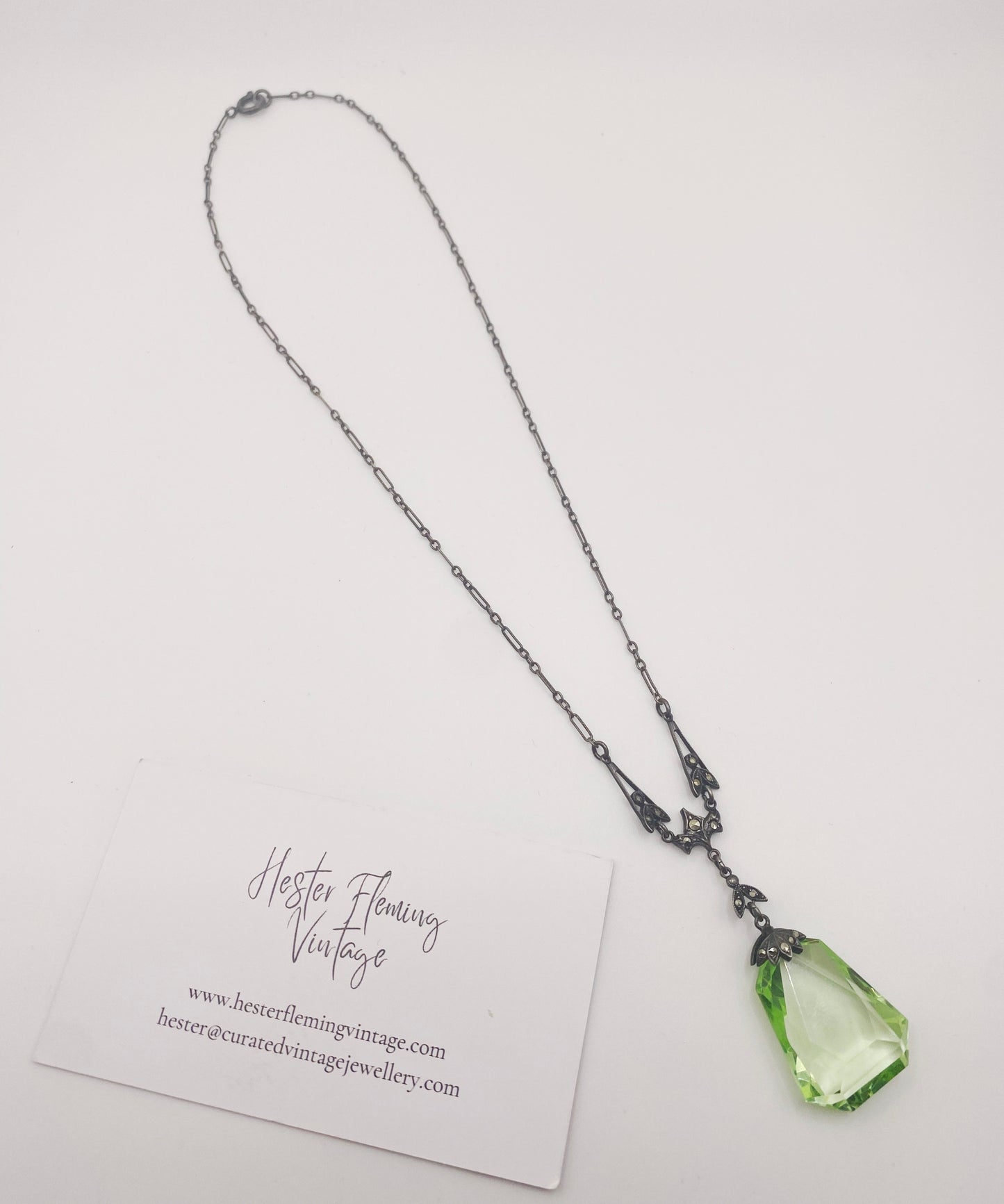 Close-up of Czech Deco uranium glass pendant. 