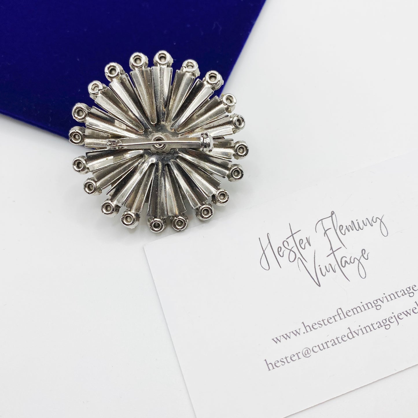 Back of mid century rhinestone brooch with rollover clasp
