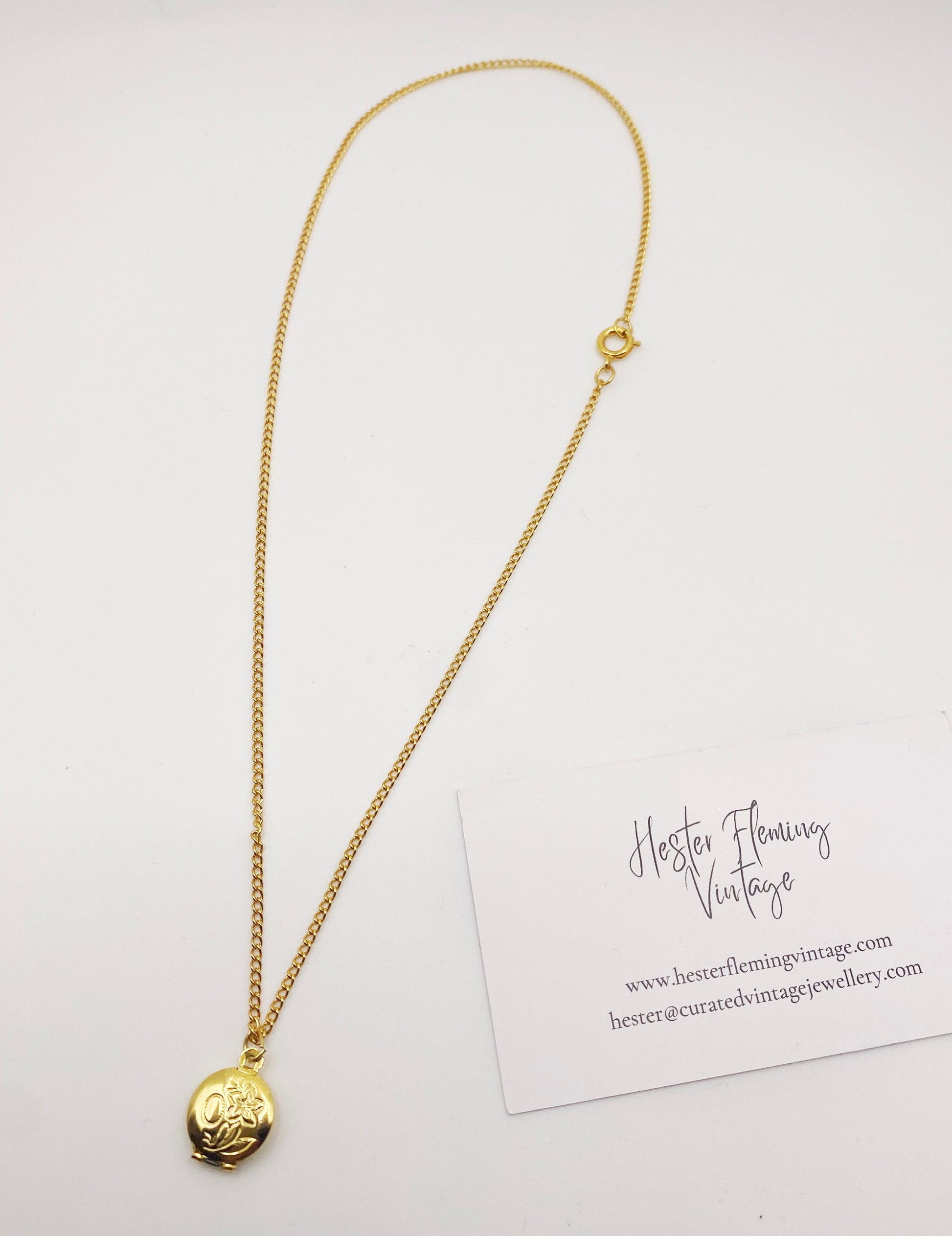 1990s gold locket charm necklace, ideal for vintage jewellery lovers.