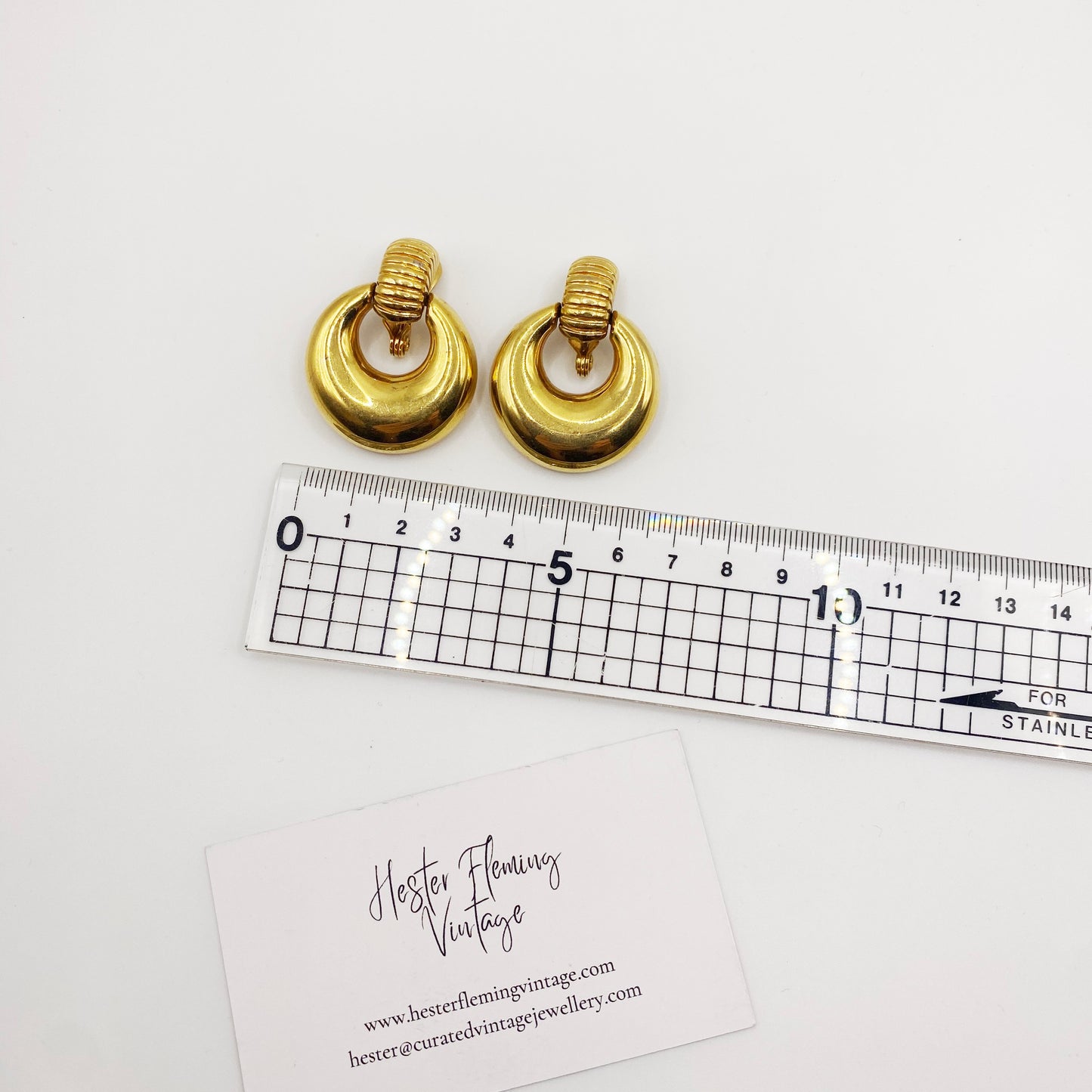 vintage Monet doorknocker earrings, bold 70s designer jewelry measurement.