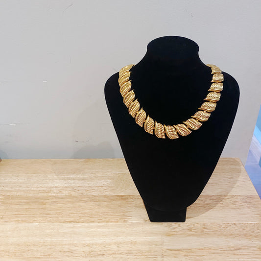 Retro 70s Napier statement necklace, collectible vintage jewelry piece on stand.