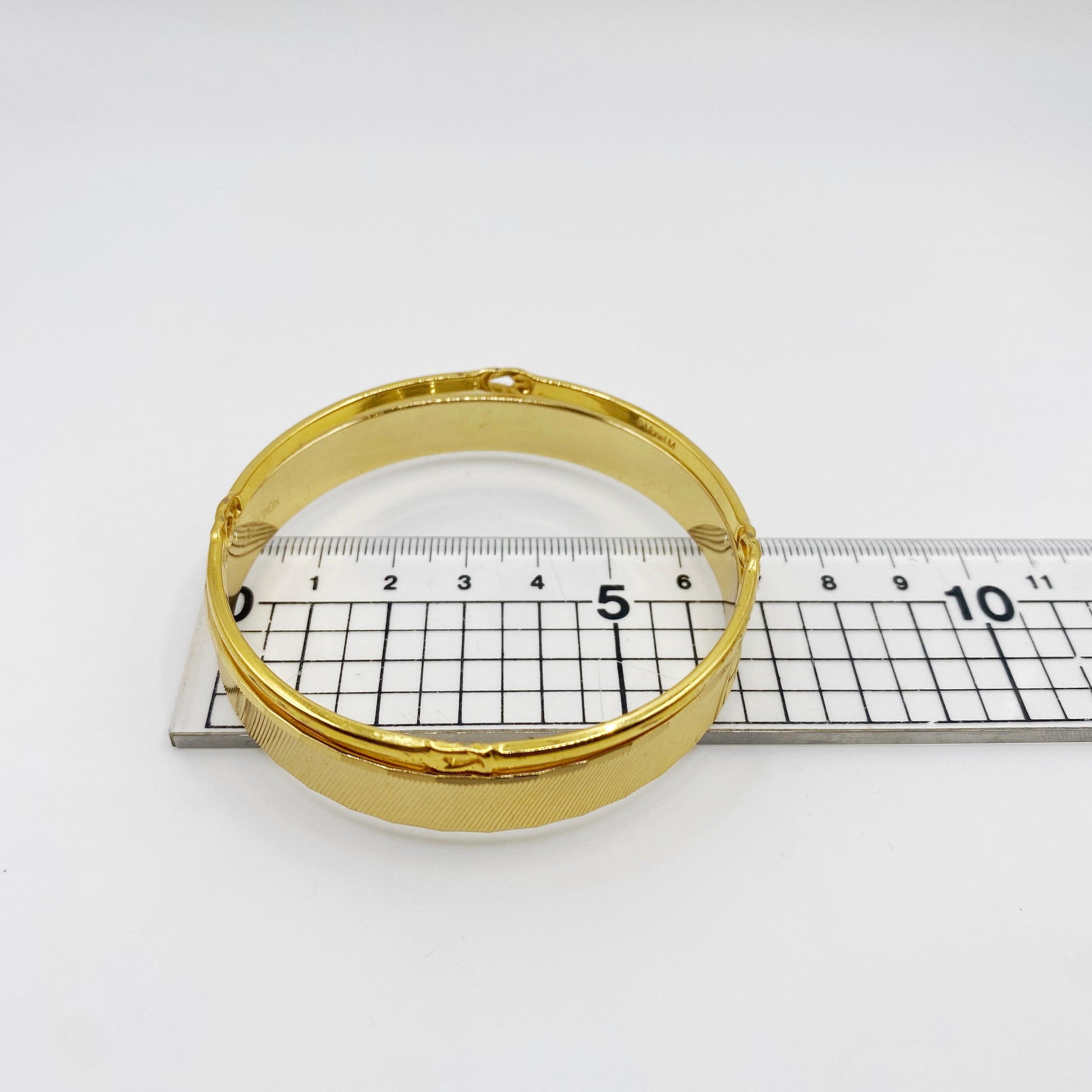 Measurement of Monet M 1970s vintage gold bangle.