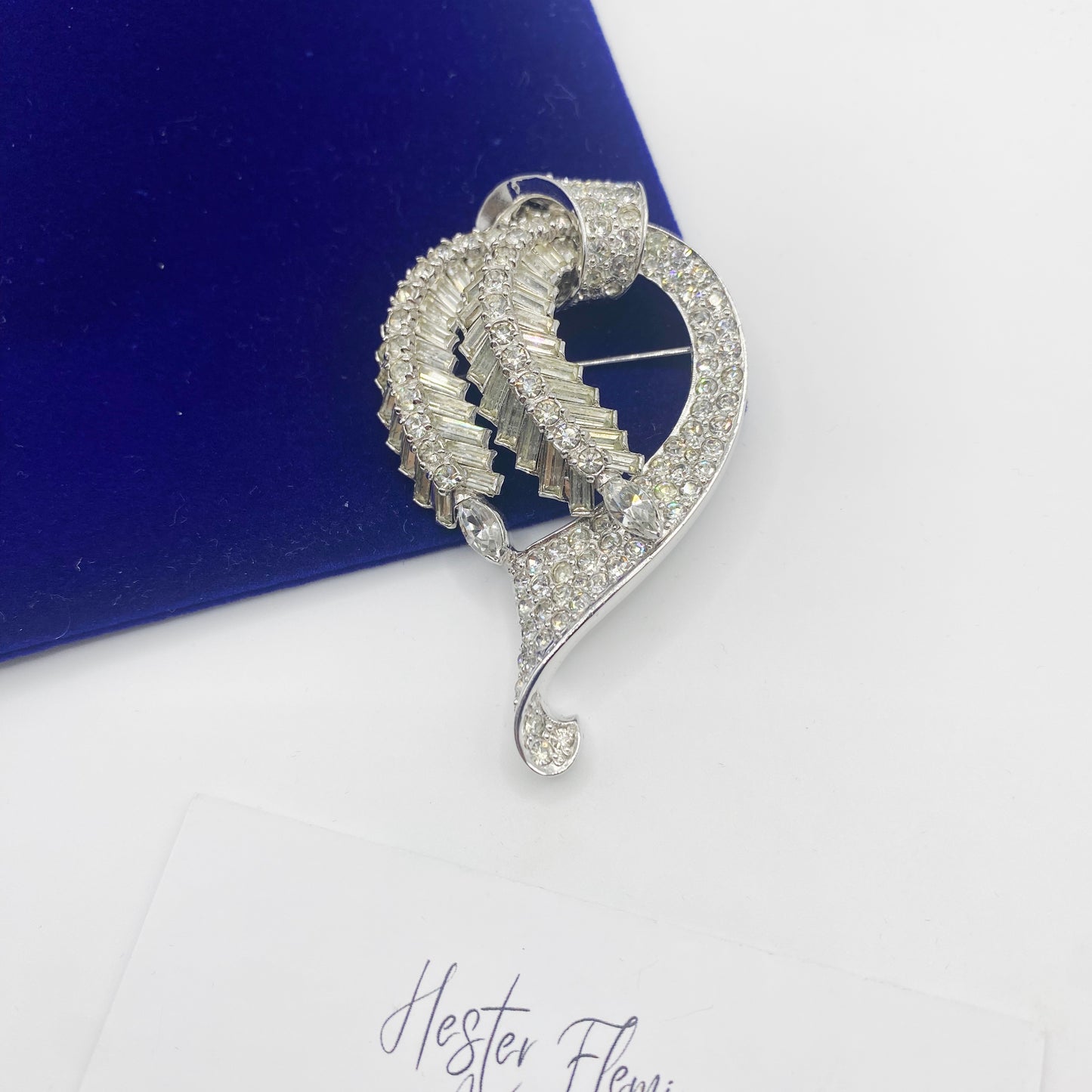 Vintage 1950s Pennino rhinestone ribbon brooch with cascading baguette crystals