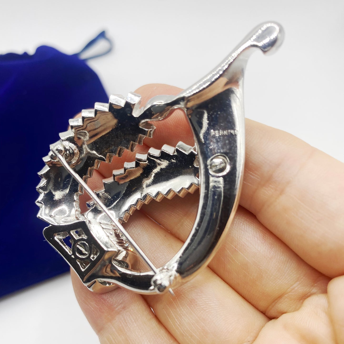 Signed Pennino brooch hallmark on rhodium plated vintage brooch