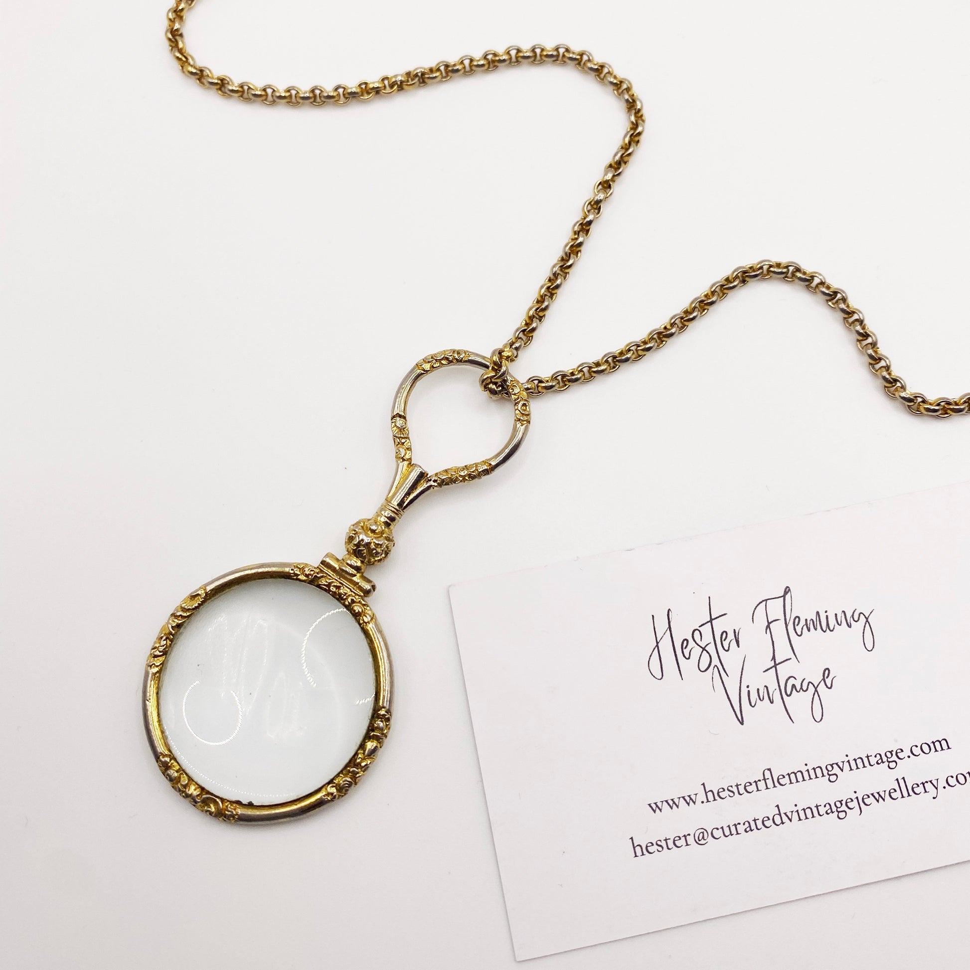 Close-up of gold-plated Quizzer pendant