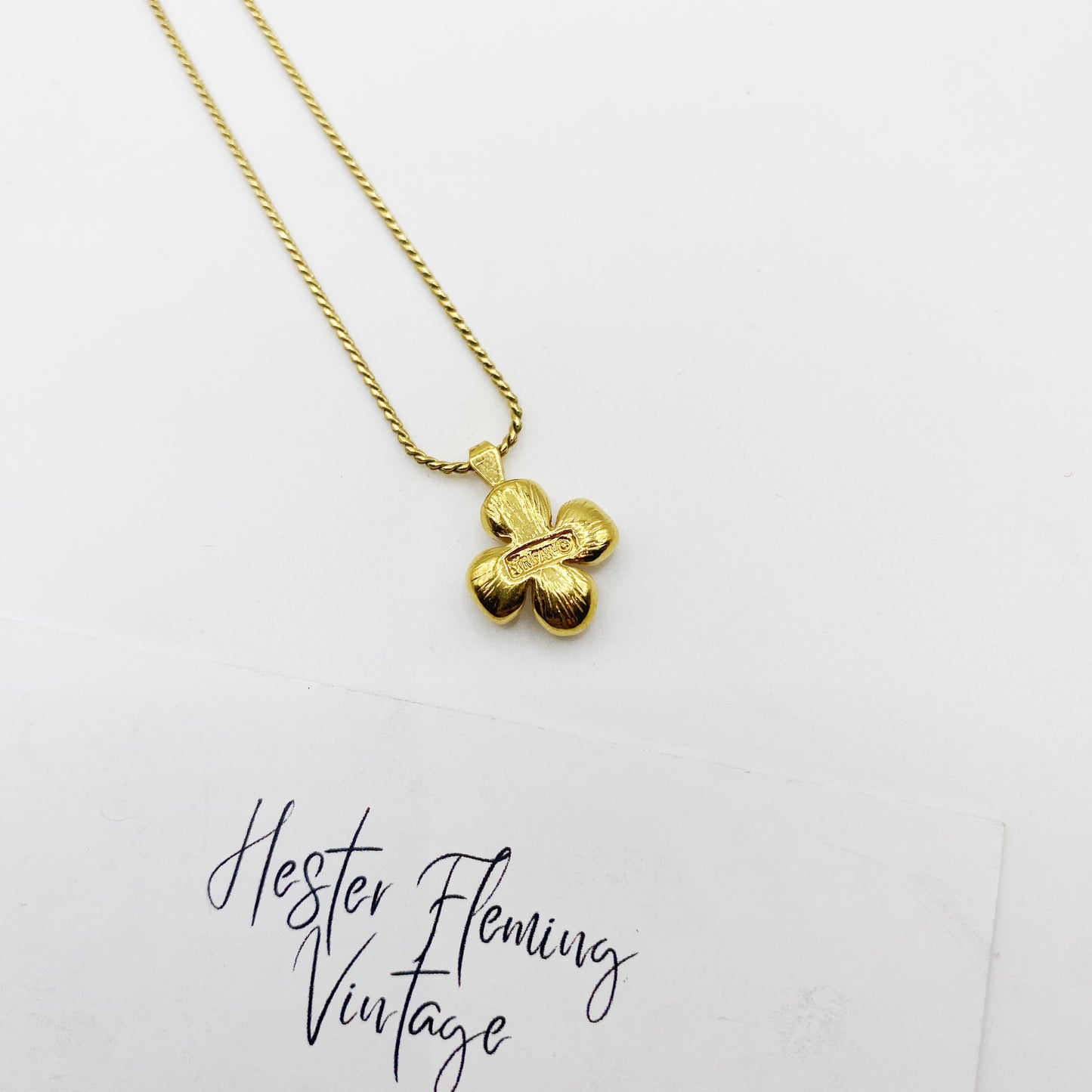Signed Trifari stamp on reverse of dogwood pendant