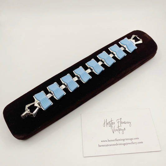 Vintage 1950s Coro bracelet with light blue thermoset panels in silvertone metal, front view