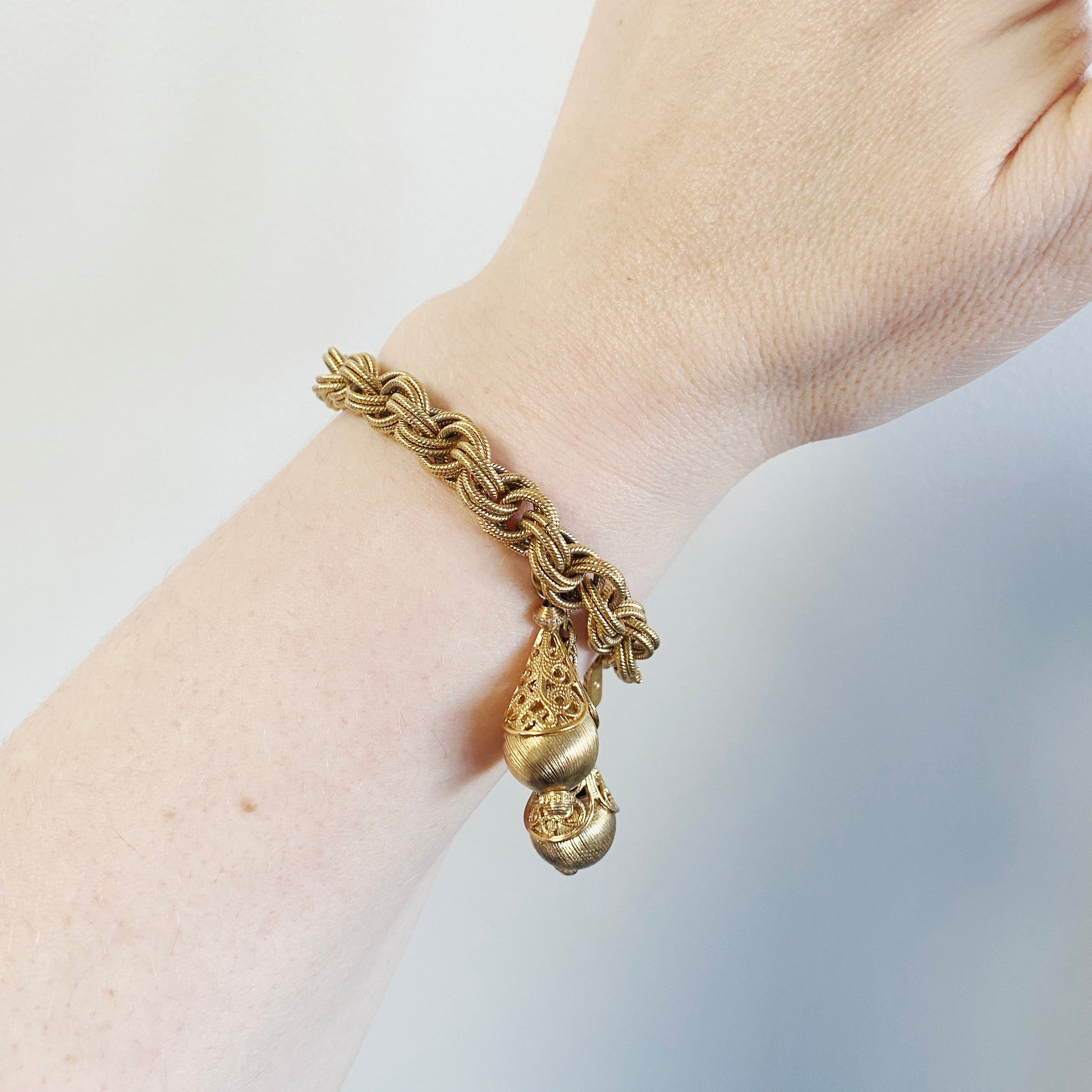 Vintage 1960s Monet bracelet, mid-century goldtone costume jewelry, book-piece collectible on model