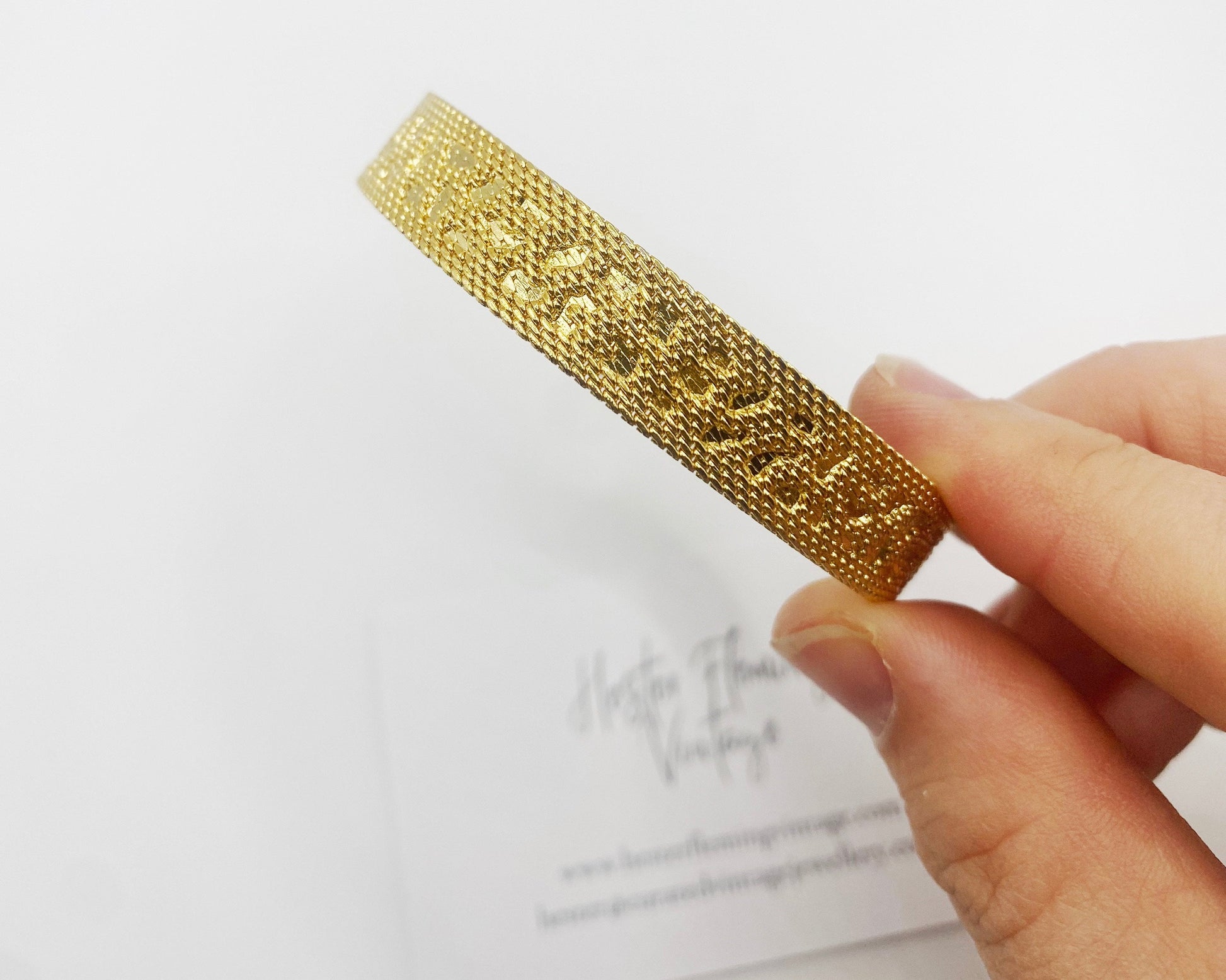 Close-up of 18kt gold-plated vintage bracelet showing 1970s mesh detailing