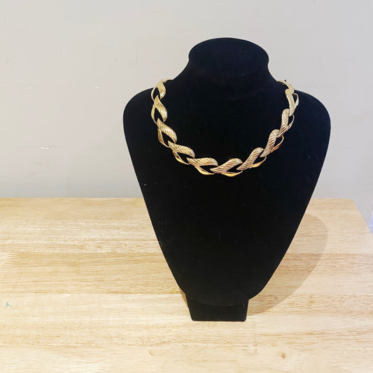 The Trifari heart necklace worn to show length, scale, and how it drapes as a statement piece