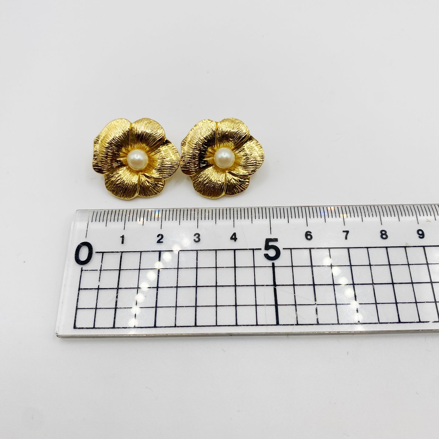 Vintage 1990s gold and faux pearl earrings for pierced ears measurement.