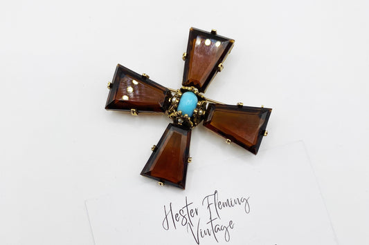Front view of a vintage 1960s Accessocraft NYC Maltese Cross brooch in gold tone