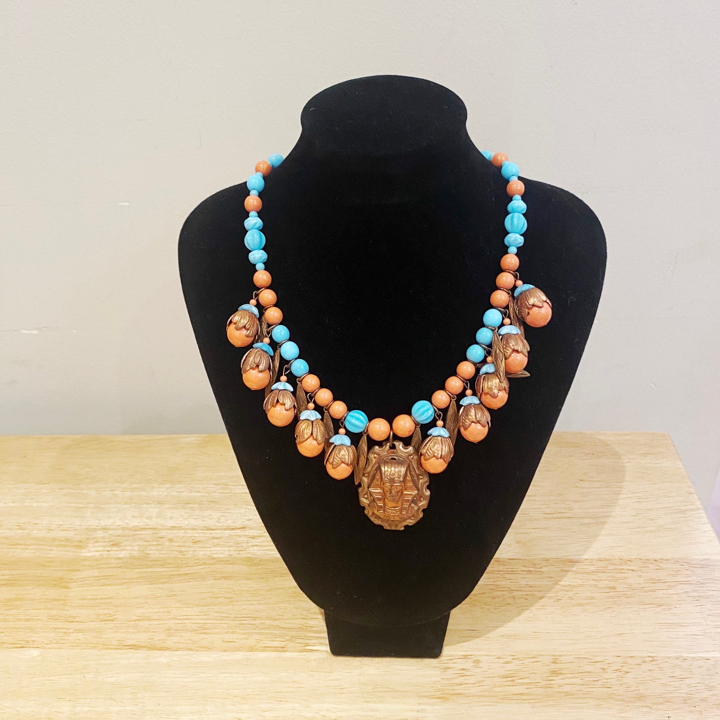 Vintage Art Deco Czech necklace featuring a detailed Pharaoh pendant and brass Egyptian motifs.