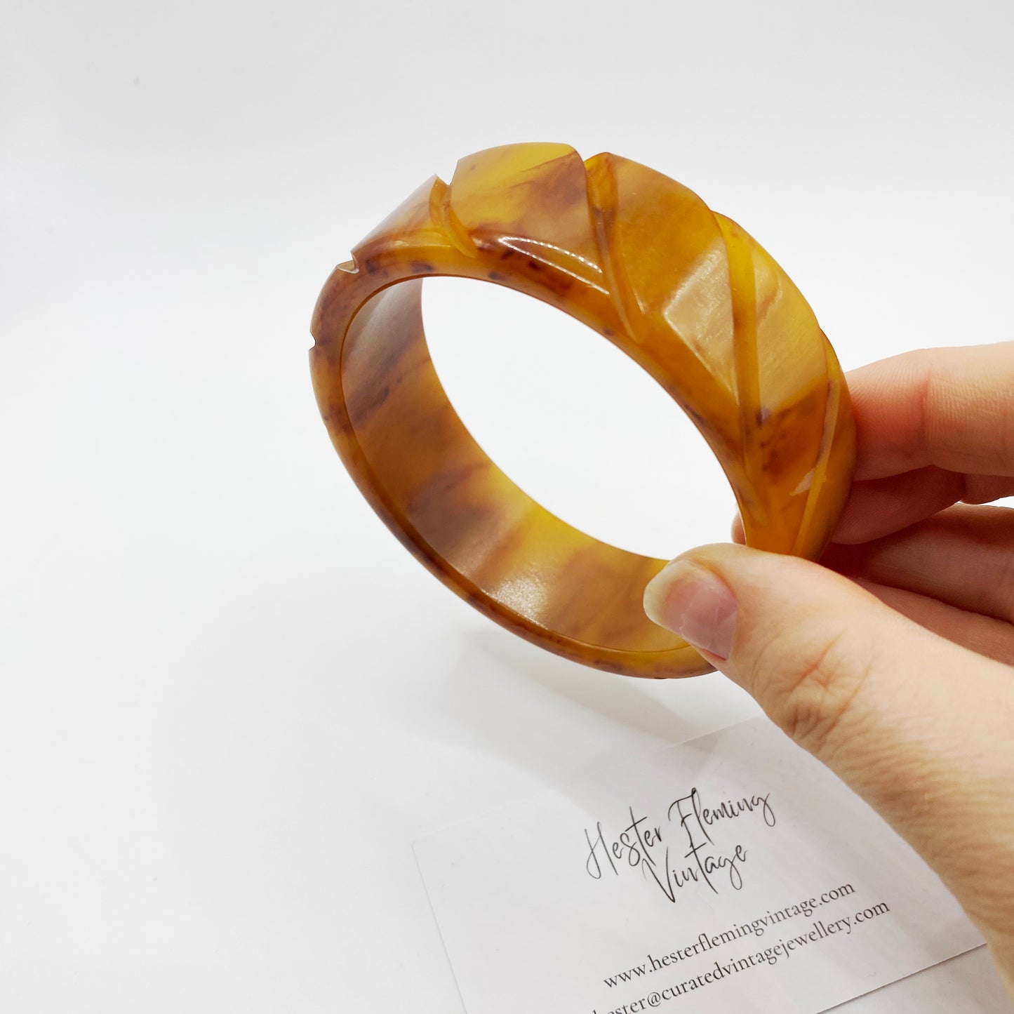 Vintage carved Bakelite bangle with warm honey and caramel marbling
