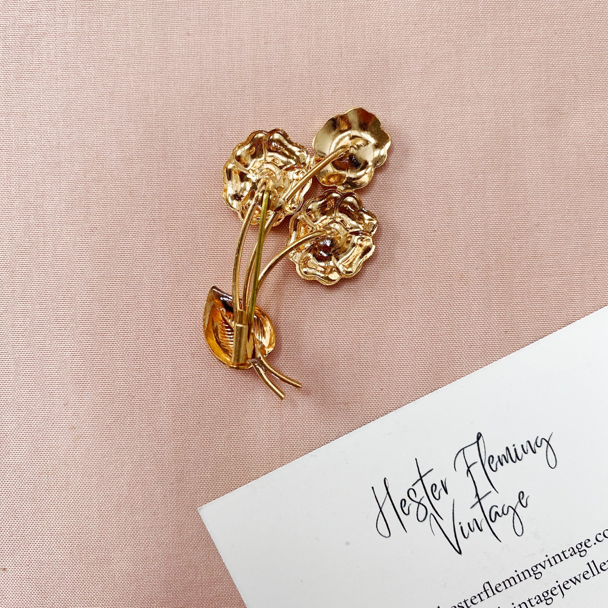 Unworn 1940s French vintage floral brooch from deadstock collection, back view.