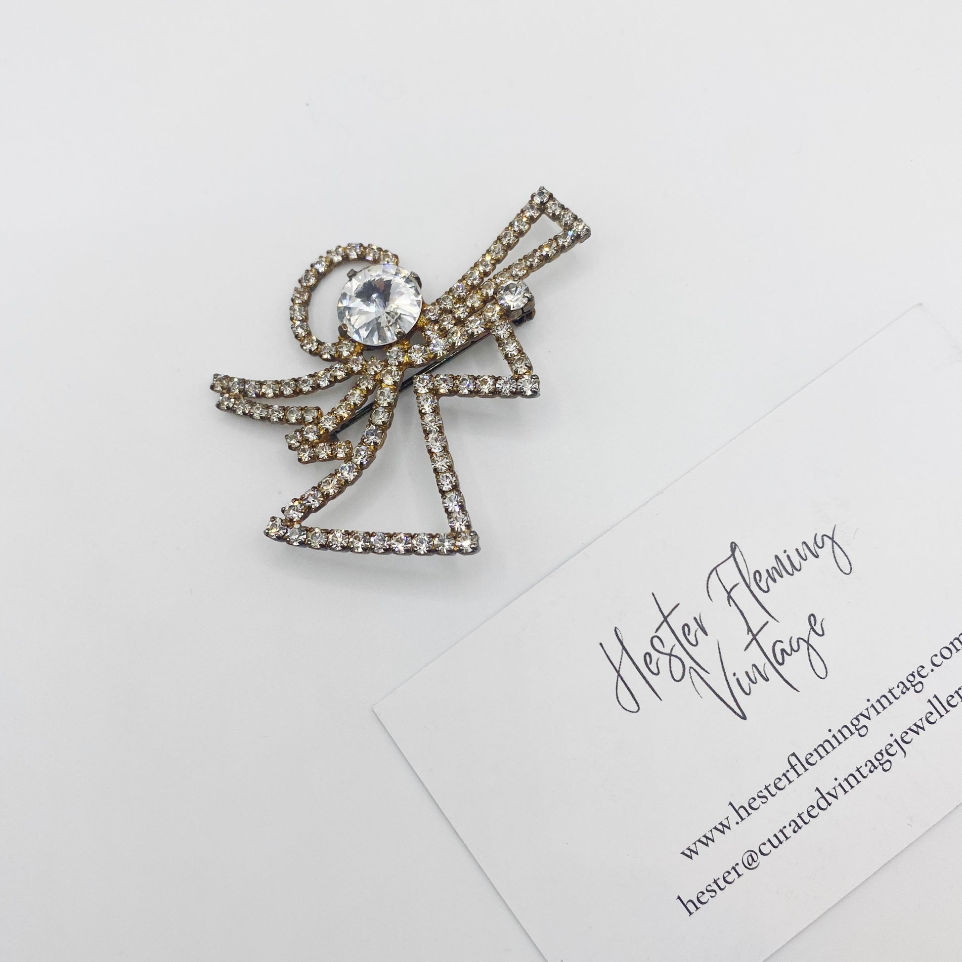 Close-up of sparkling Swarovski crystals on vintage Eisenberg Ice Christmas Angel Brooch.
