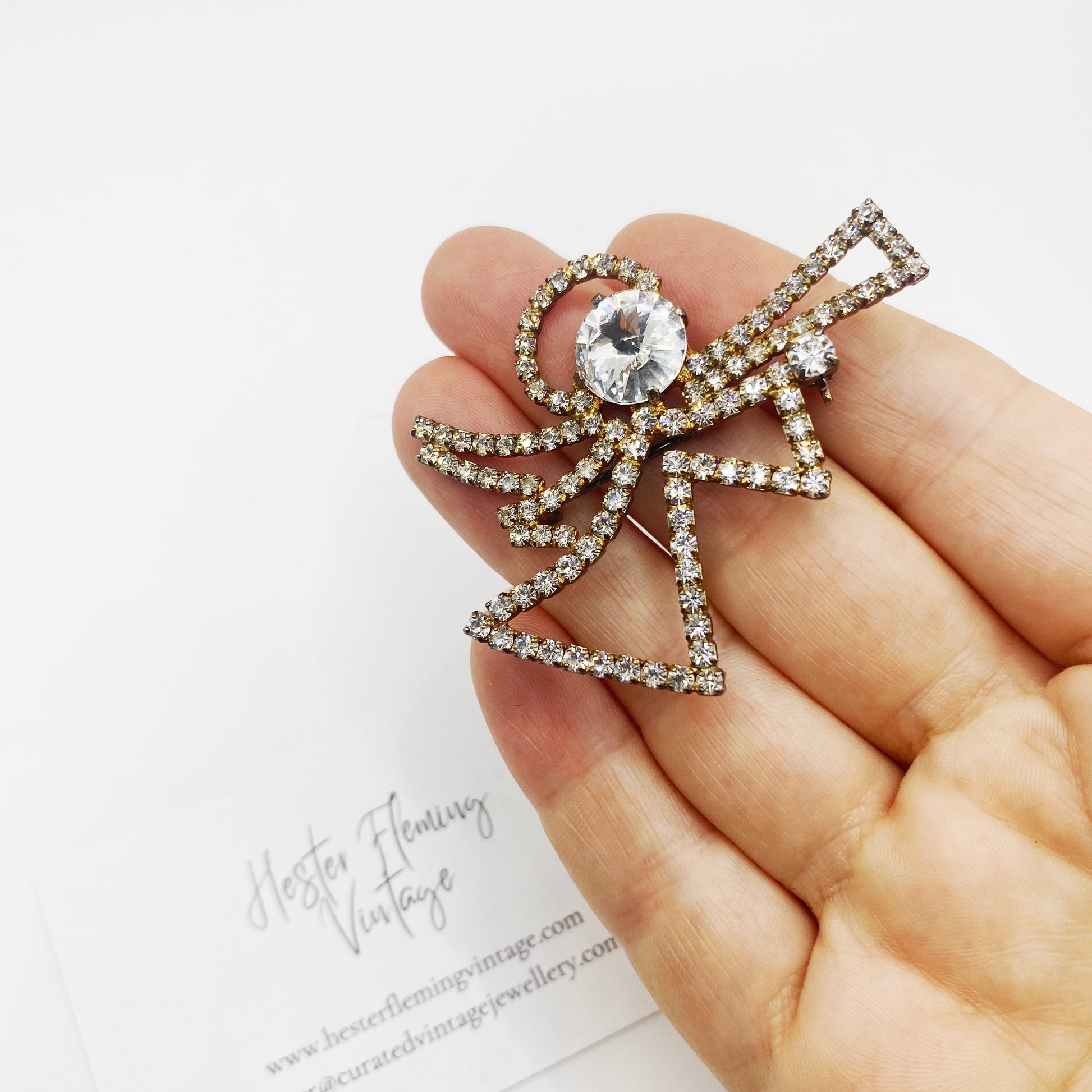 Vintage 1950s Eisenberg Ice Christmas Angel Brooch with sparkling Swarovski crystals, front view