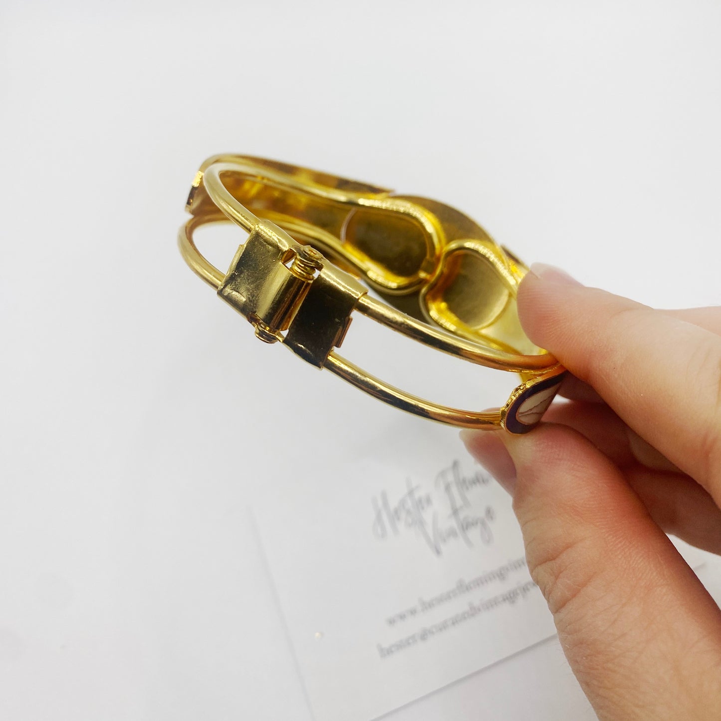 Side view of hinged vintage enamel bangle, deadstock 1980s jewellery