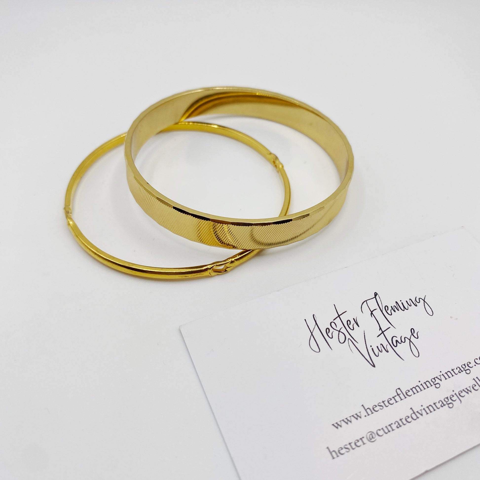 1970s vintage Monet gold bangle set presented in elegant packaging, perfect gift for collectors.