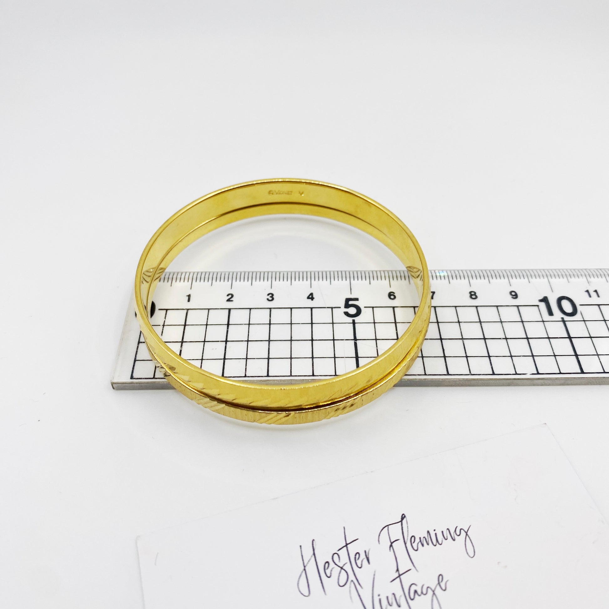 Stacked vintage Monet bangles measurement