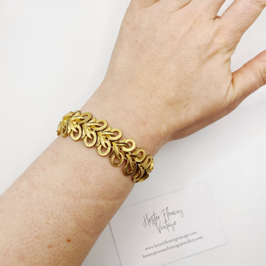 Vintage Monet Felicia bracelet, 1969 launch, gold-plated link design with safety chain, 1960s/70s signed collectible jewellery.
